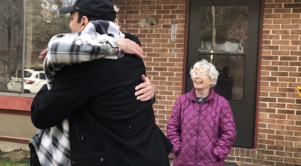 Richard Zaher hugs man in McDowell County on his first visit